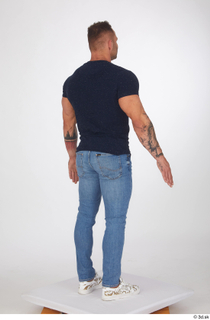 Garrott blue jeans blue t shirt casual dressed standing white…
